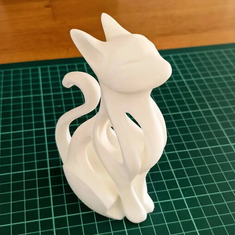 Elegant modern cat sculpture in a sitting position - 3D printed decoration
